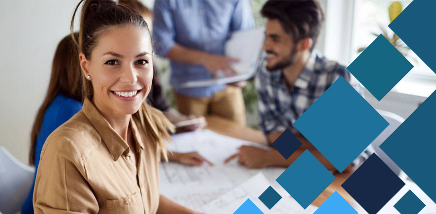 About-us-Image-1 Smiling business professional in a meeting, representing collaboration and learning resources on Identity & Access Management (IAM) best practices.